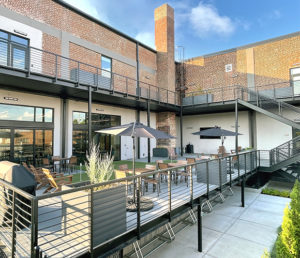 A newly transformed space into an open, airy outdoor deck for employees to lounge.