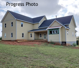 A progress photo of the farmhouse during the beginning stages of the process.