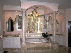 The interior of the French Provencal-styled homes bathroom, showing the bathtub and sinks.