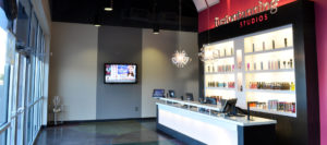 An interior view of the completed total rebranding of Fusion Tanning Studios to develop a modern design.