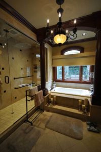 A view of the added walk-in shower and whirlpool of the entirely renovated master bathroom.