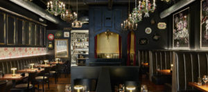 The interior of Osteria Stella, showing the moody, intimate setting of the restaurant.